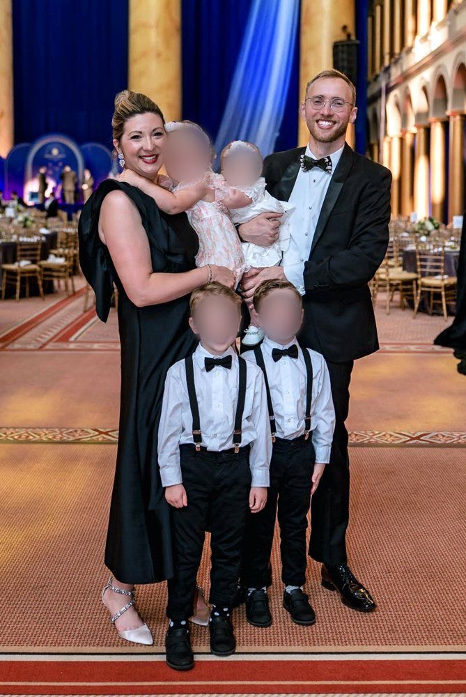 Katelyn and John Shelton with their four children at a formal event