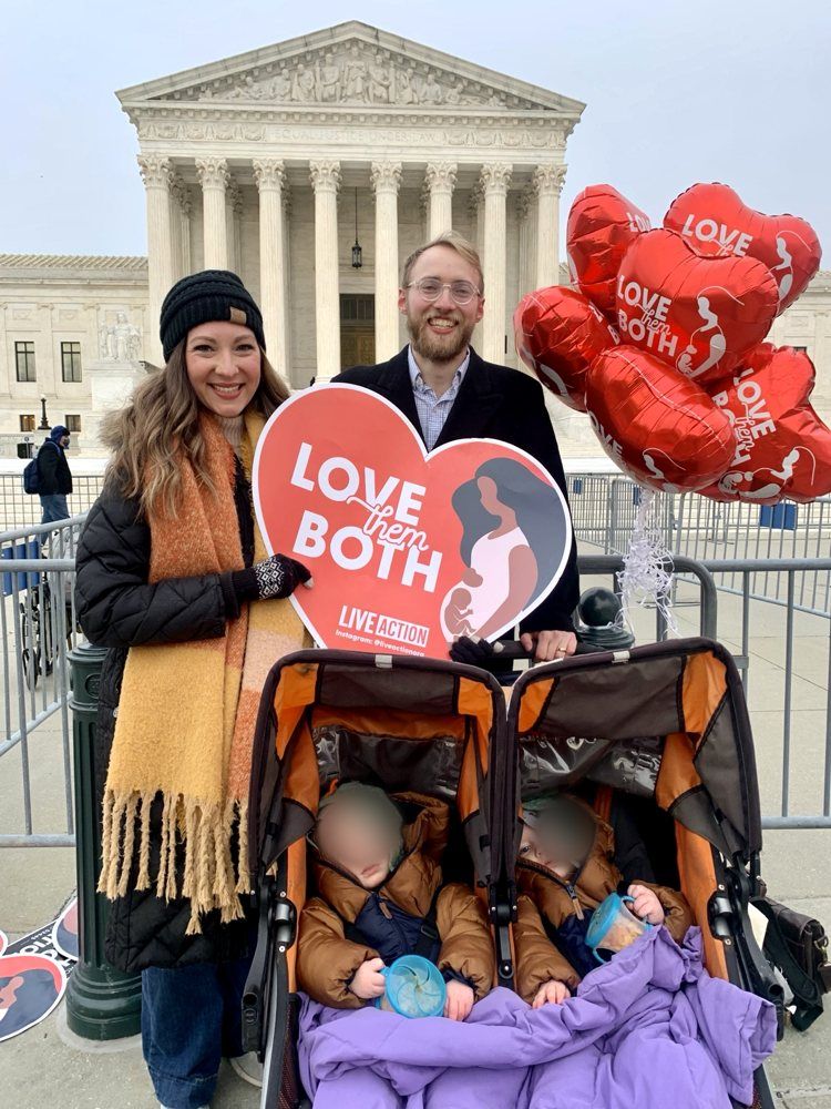 Katelyn and John Shelton with their twins at the Supreme Court